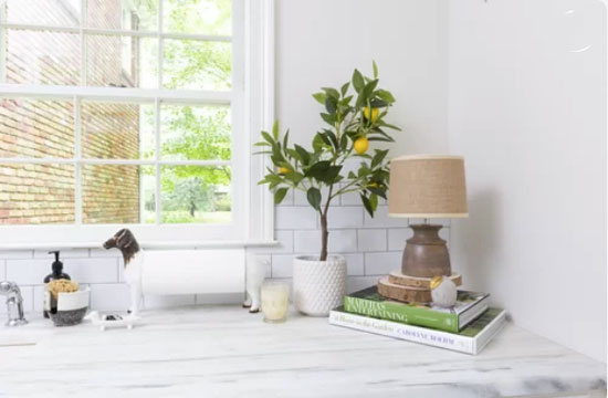 white cabinets and marble countertop in white kitchen