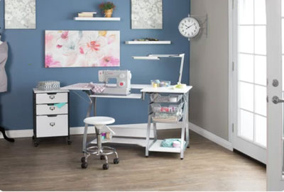 blue gray work room with sewing machine