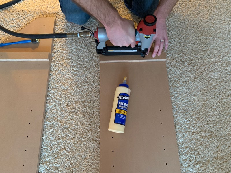 glue and brad-nail sides of bookcase into place