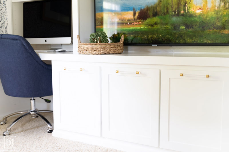 lucite pulls on built-in cabinets in office