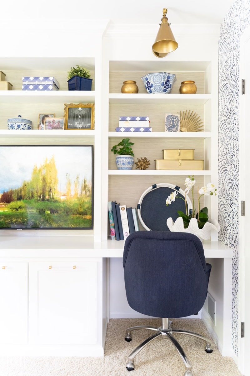 grasscloth wallpapered bookshelves with diy built-in bookshelves