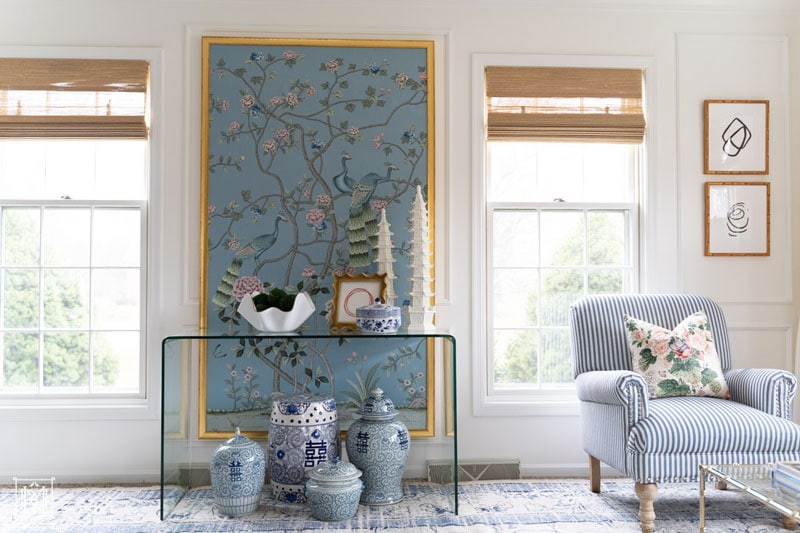 chinoiserie panel in gold frame and bamboo blinds