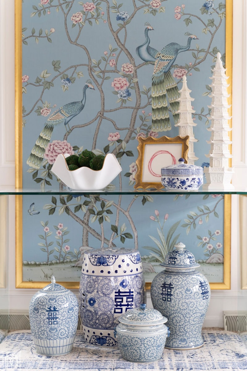 diy chinoiserie panel with white walls and table in grandmillennial living room