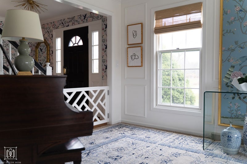 living room with chinoiserie decor and chinoiserie wallpaper- blue oriental rug