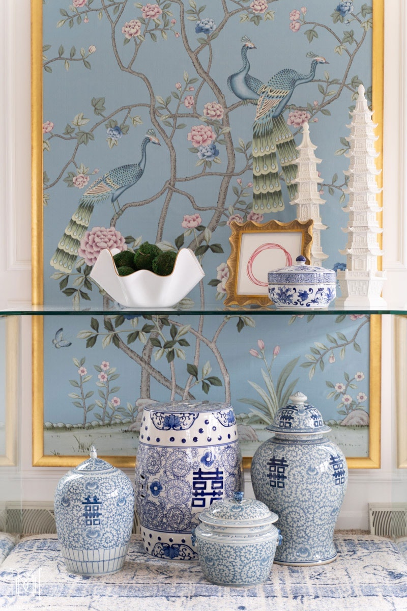 beautiful handpainted chinoiserie panels with blue and white ginger jars and pottery