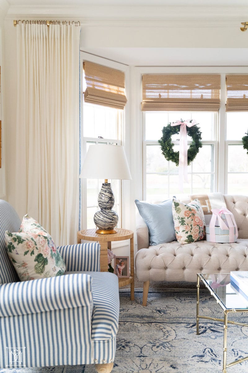 custom acrylic curtain rod in living room with bay window and sofa