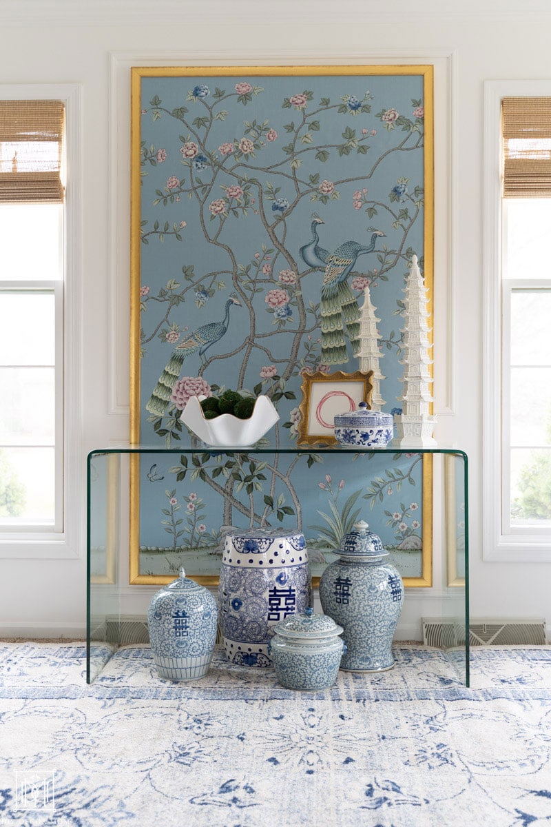 diy chinoiserie panel frame- blue large chinoiserie panel with gold frame in white living room with blue and white ginger jars