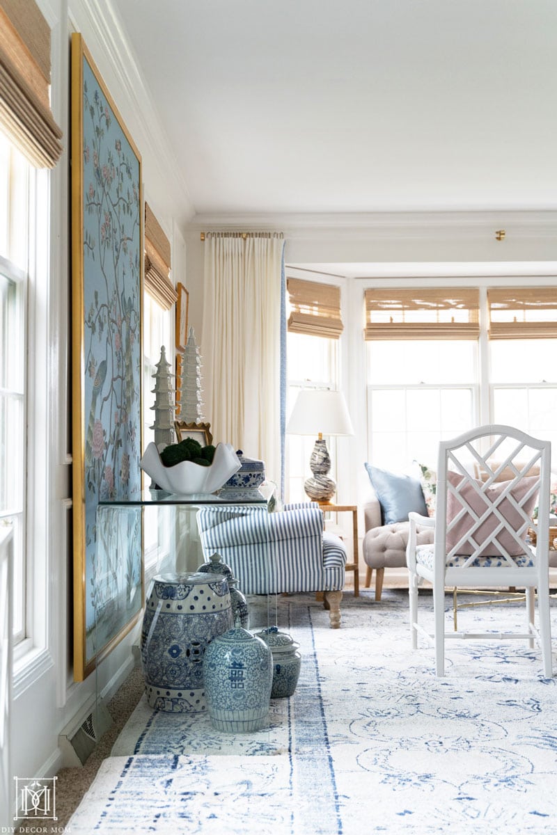 beautiful blue and white living room with custom diy lucite curtain rod and white curtains